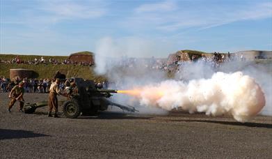 Gun firing on the Fort Nelson Parade Ground