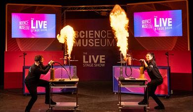 Photograph of flames being lit at a Science Museum Live show