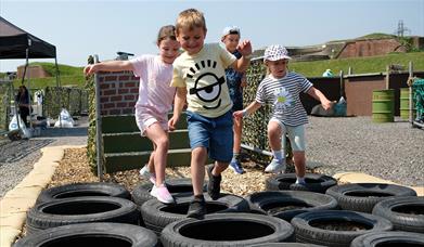 Children enjoying the assault course at Fort Nelson