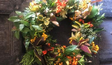 A Christmas wreath adorning a wooden door