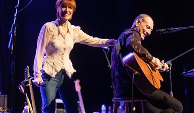 Photograph pf Kiki Dee and Carmelo Luggeri performing live