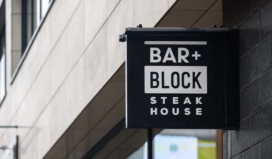 Exterior sign for Bar + Block Steak House