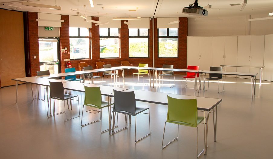 Internal shot of the Dulverton Room, showing chairs and tables set for a meeting