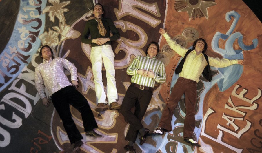 Photograph showing the four members of The Small Fakers
