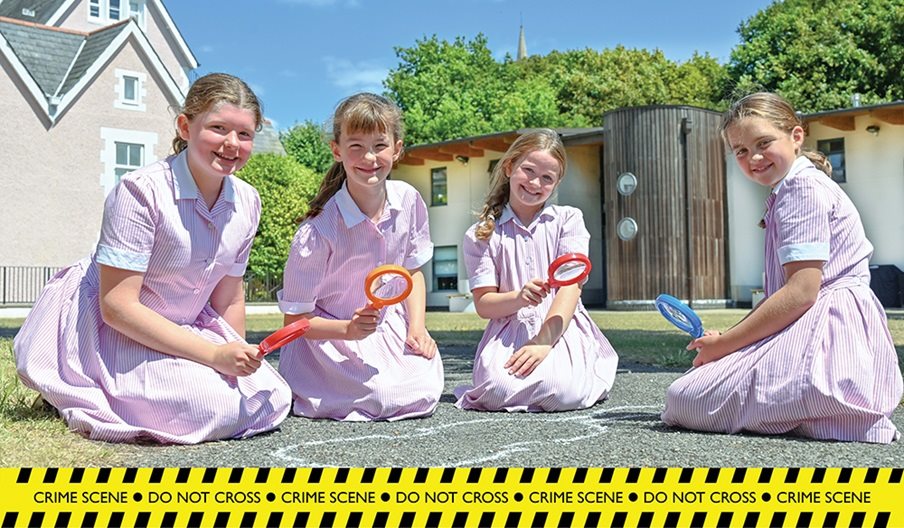 Four girls take part in the Forensic Science Trail at Portsmouth High School