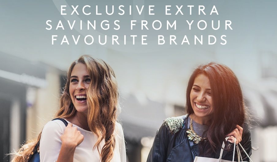 Two women shopping at Gunwharf Quays under the tagline: Exclusive extra savings from your favourite brands