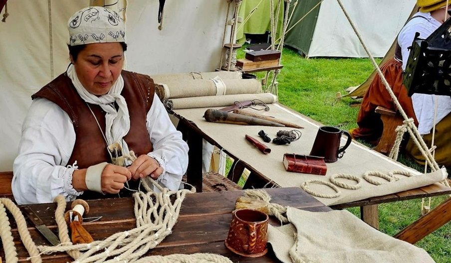 Sarah Liscoe making a historical sail using traditional techniques