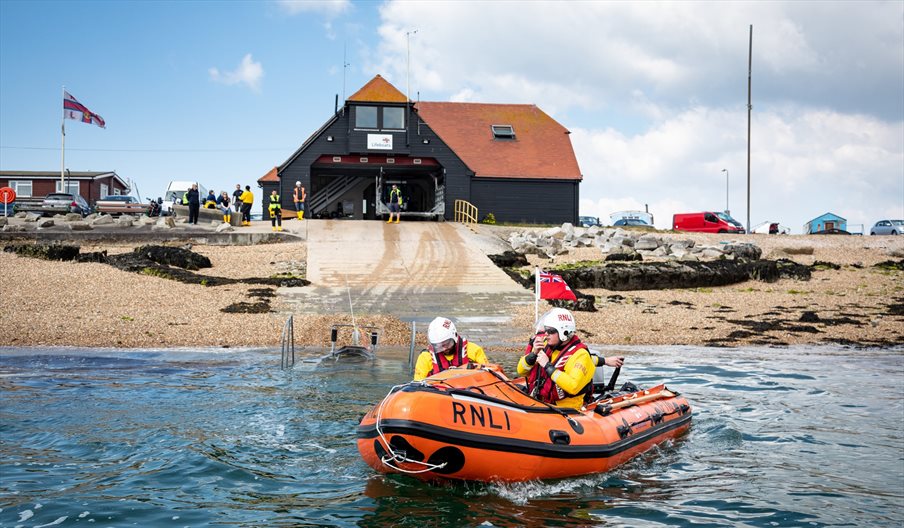 Photograph of a lifeboat heading out of the RNLI station at Eastney