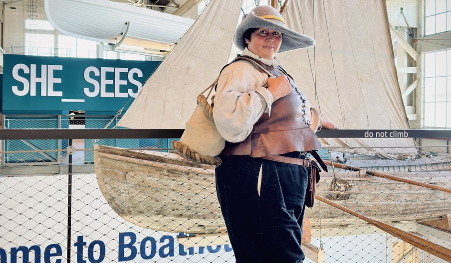 Sarah Liscoe at Boathouse 4 modelling a small, open-top bag