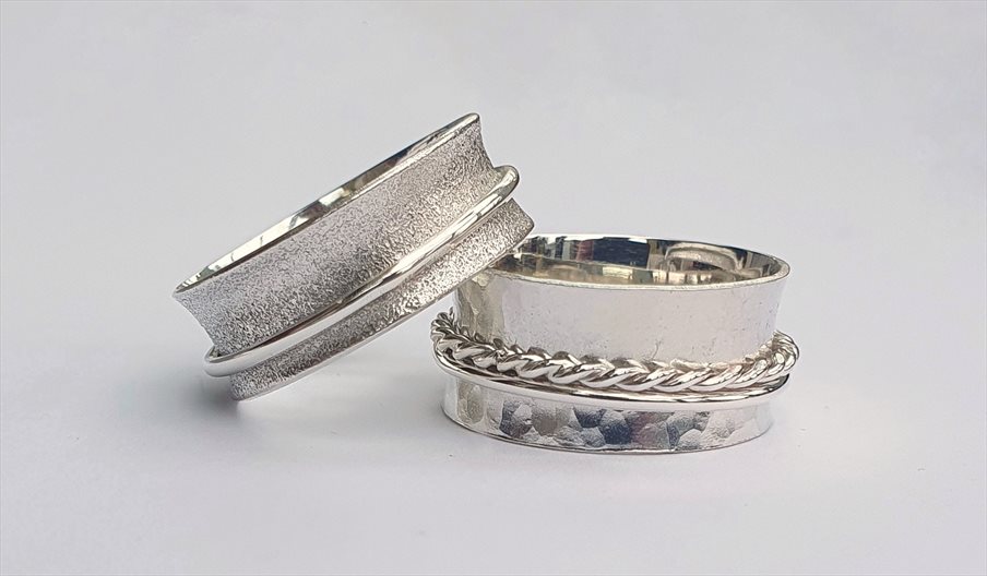 Photograph of two silver spinner rings
