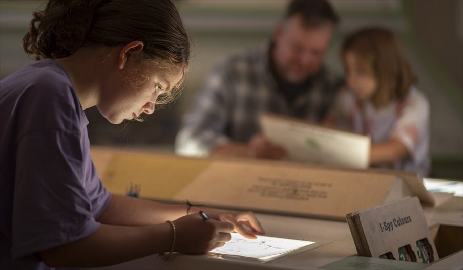 Girl taking part in Spy School activities at The D-Day Story in Portsmouth