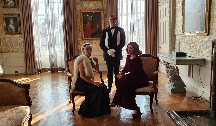 Three people in regency wear at Stansted House
