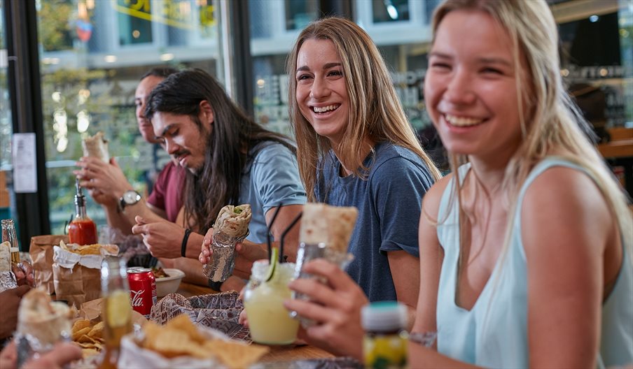 Group of friends eating in at Tortilla