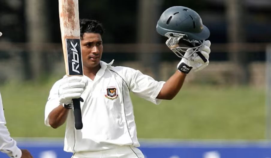 A cricket player holding his helmet and bat.