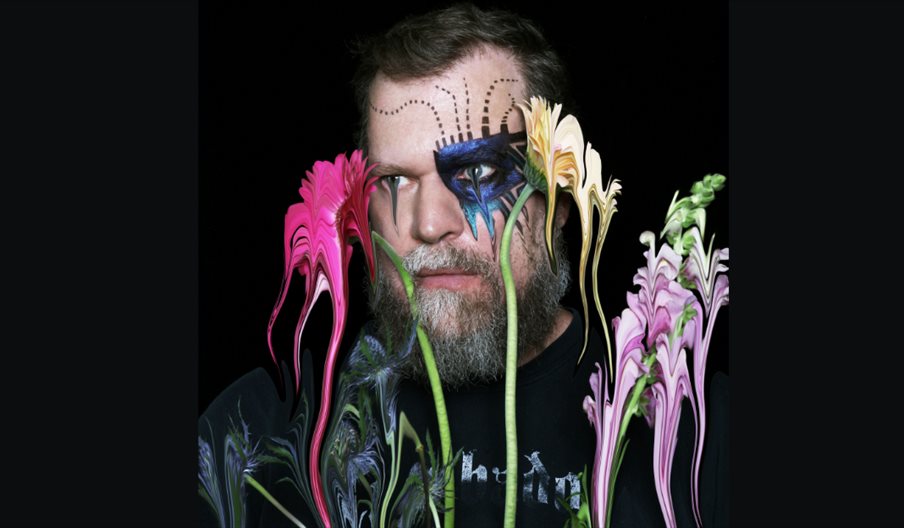 Picture of singer John Grant with flowers.