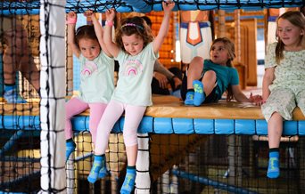 Children enjoying the climbing activities at Exploria