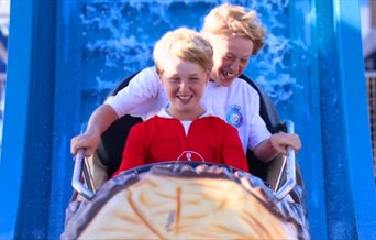 People enjoying the rides at Clarence Pier Amusement Park