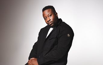 Press shot of Babatunde Aléshé for his latest stand-up tour: High Expectations