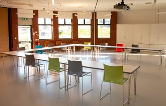 Internal shot of the Dulverton Room, showing chairs and tables set for a meeting