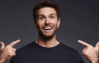 Photograph of Joel Dommett for his latest stand-up tour: Happy Idiot