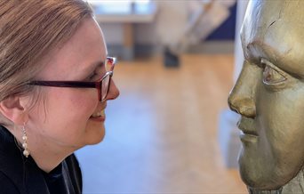 The NMRN's Head of Collections facing a Figurehead