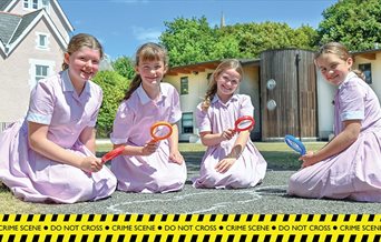 Four girls take part in the Forensic Science Trail at Portsmouth High School