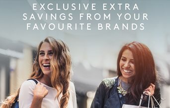 Two women shopping at Gunwharf Quays under the tagline: Exclusive extra savings from your favourite brands