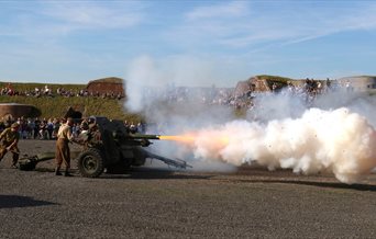 Gun firing on the Fort Nelson Parade Ground