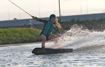 A woman using the high speed cable wake line