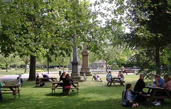 People enjoying the benches at Victoria park