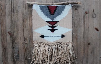 A weaved hanging decoration made on a loom