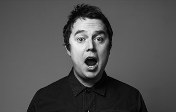 Black and white photograph of Paul McCaffrey