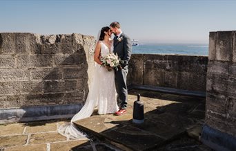 A newlywed couple at the Square Tower