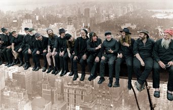 Photograph of the Spooky Men's Chorale, aping the famous New York Girder image