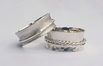Photograph of two silver spinner rings