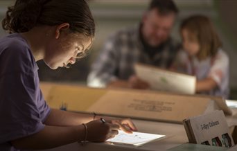 Girl taking part in Spy School activities at The D-Day Story in Portsmouth