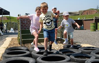Children enjoying the assault course at Fort Nelson
