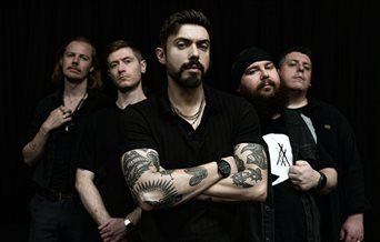 Photograph of the five members of Summoners