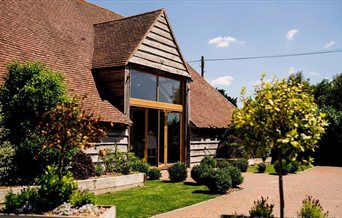 The exterior of The Barn at Skylarks Country Club