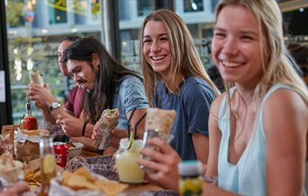 Group of friends eating in at Tortilla