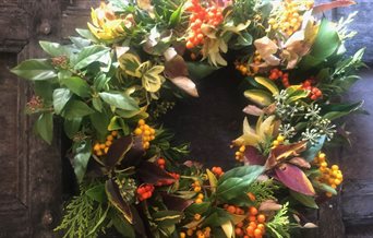 A Christmas wreath adorning a wooden door