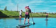 Paddleboarders take to the water at South Coast Wakepark