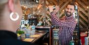 A mixologist prepares a fresh drink at a Port Solent bar