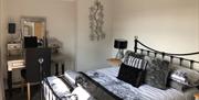 A double bedroom in The Beach at the End of the Road - The Roof Terrace