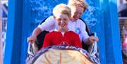 People enjoying the rides at Clarence Pier Amusement Park