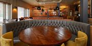 A large circular booth at the Beefeater restaurant