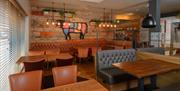 Interior of a Beefeater Restaurant, with tables for four