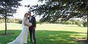 Newlyweds enjoying the Cams Hall Estate Golf Club grounds.