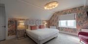 Dusky pink decor at a double room in Florence Gardens Boutique Hotel and Restaurant