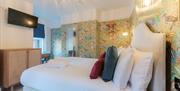 A colourful double room available at Florence House Boutique Hotel and Restaurant